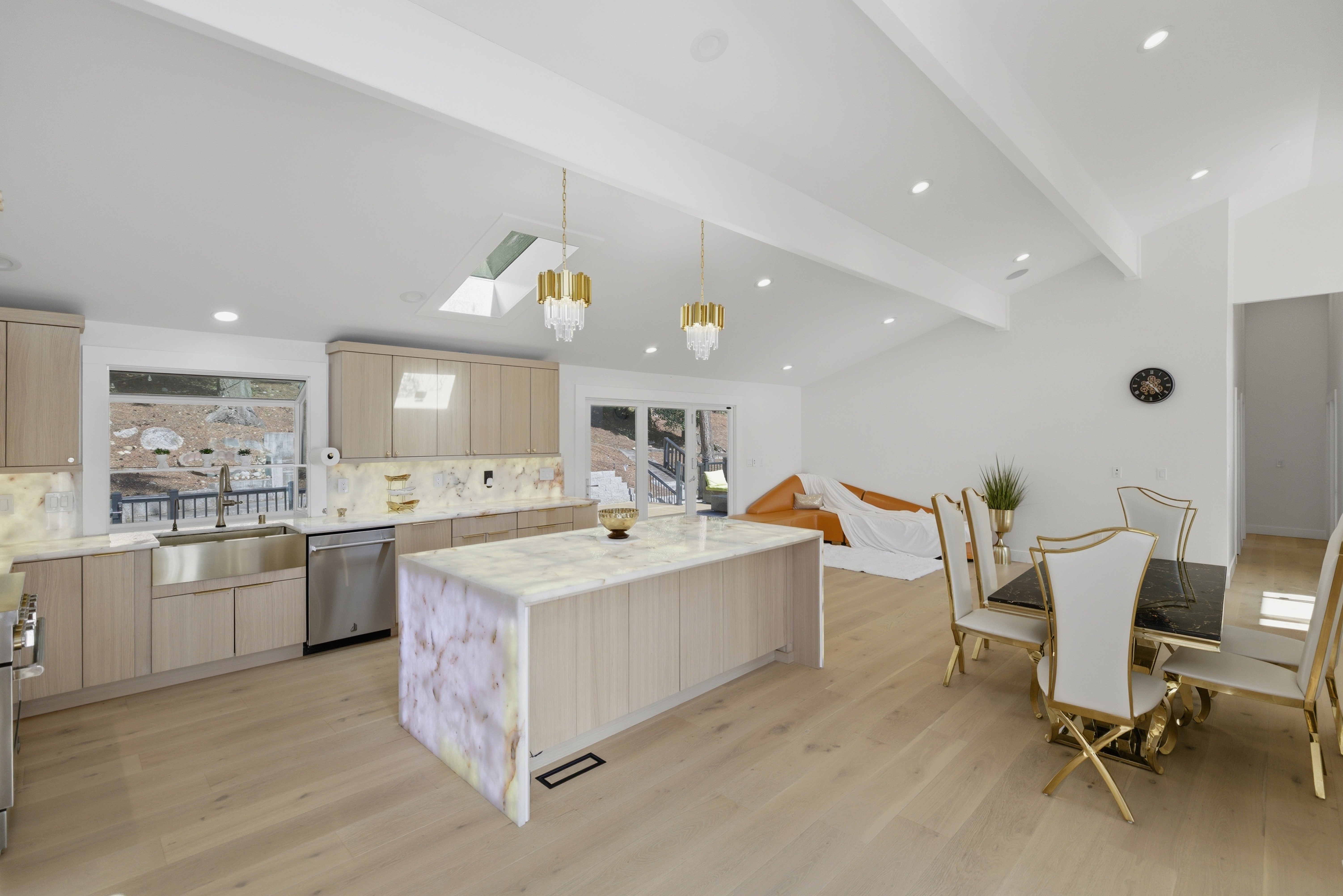 Chef's kitchen with backlit onyx countertops and Belmont cabinetry